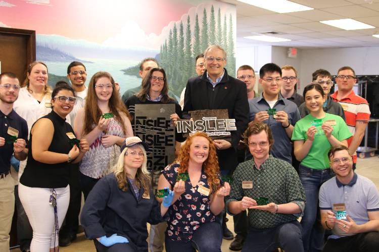 Edmonds CC students present Gov. Inslee with a laser-cut souvenir that was designed and made in the college’s Rapid Proto Lab.