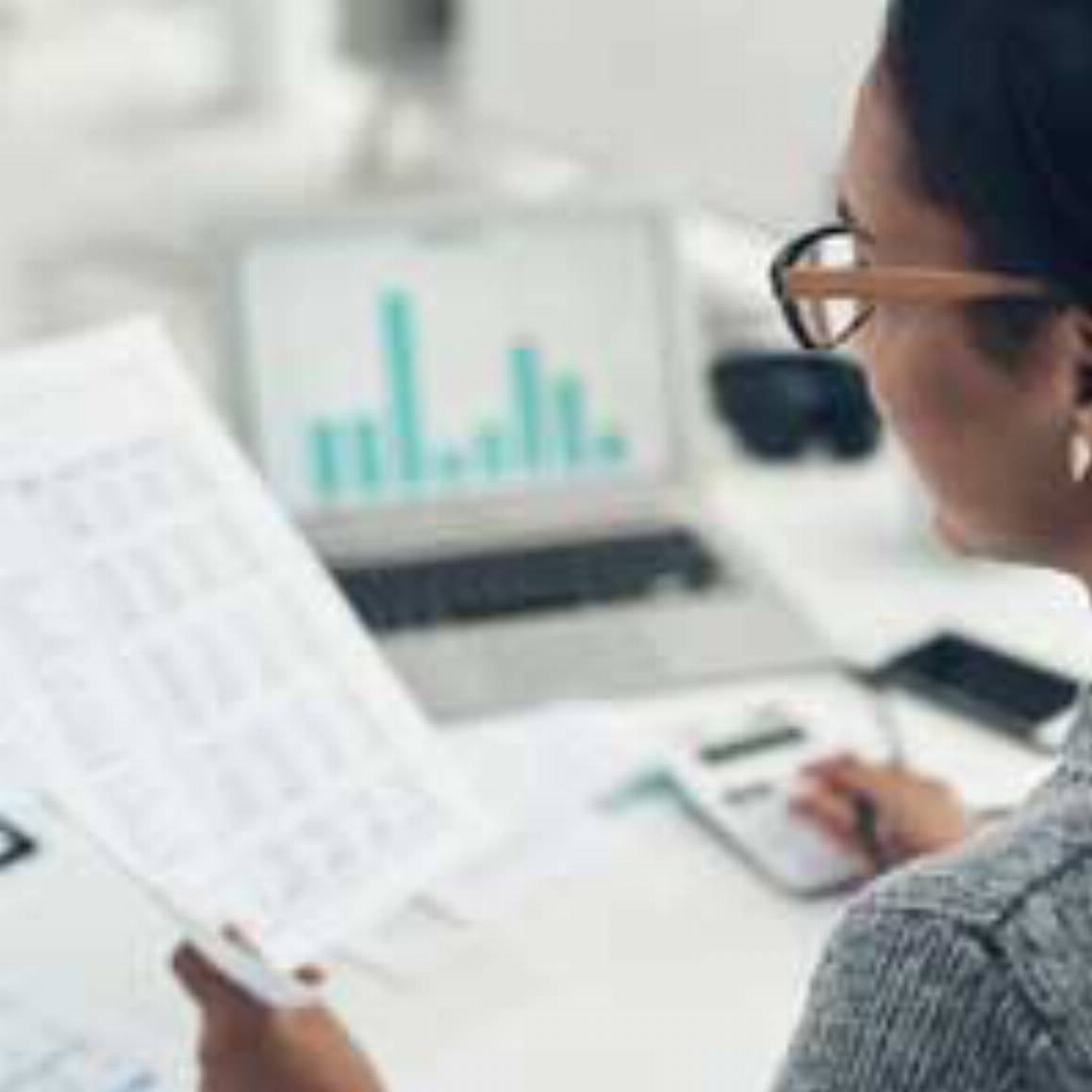 woman looking at accounting reports