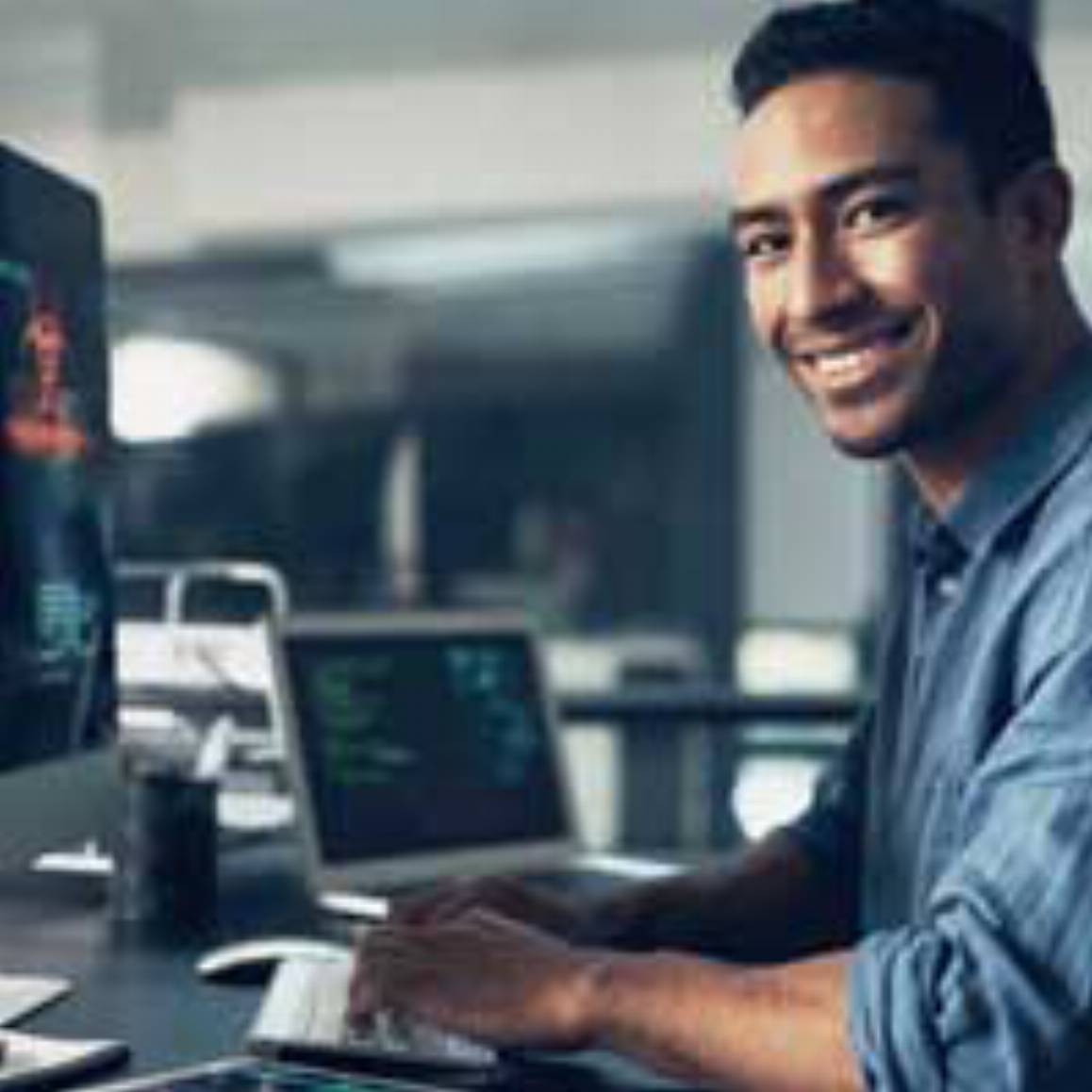 man working on a desktop computer