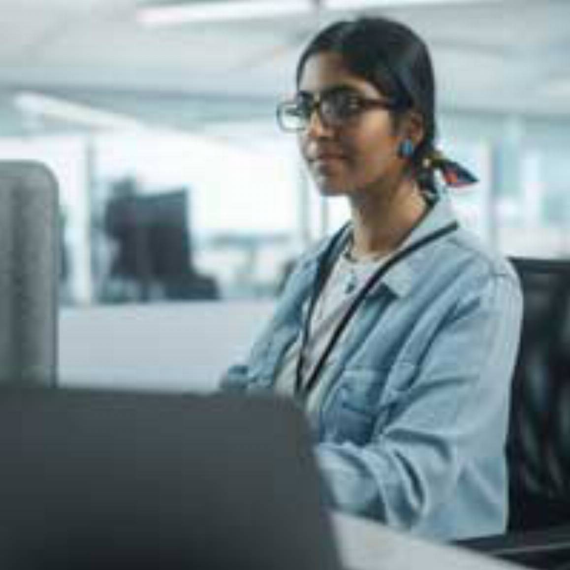 woman looking at a computer screen