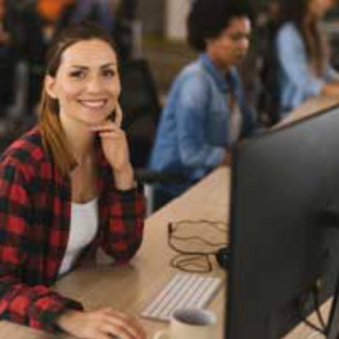 woman working on a desktop computer