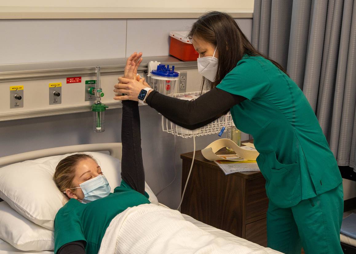 Students in the patient care technician program at Edmonds College gain hands-on experience during labs. (Arutyun Sargsyan / Edmonds College)