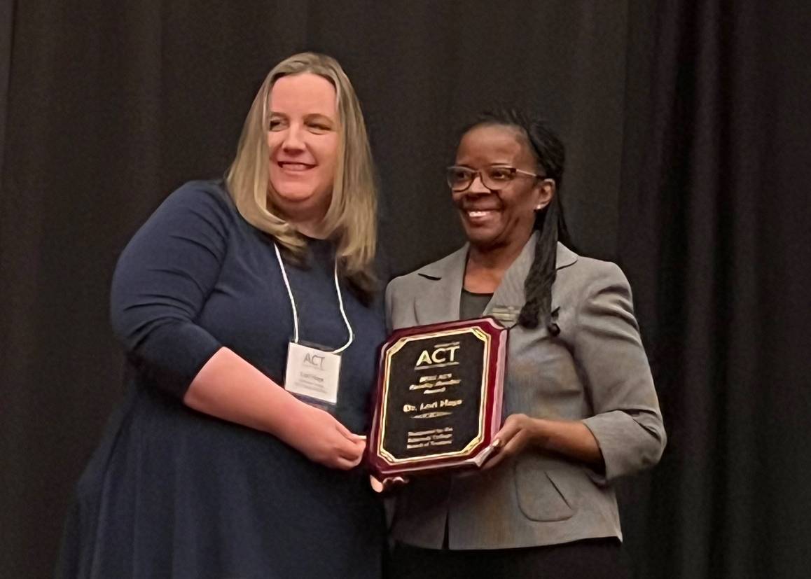 Dr. Lori Hays (left) received the Faculty of the Year award during a ceremony in Spokane, Wash., on Thursday, May 22. (Photo courtesy of Edmonds College Trustee Courtney Wooten)