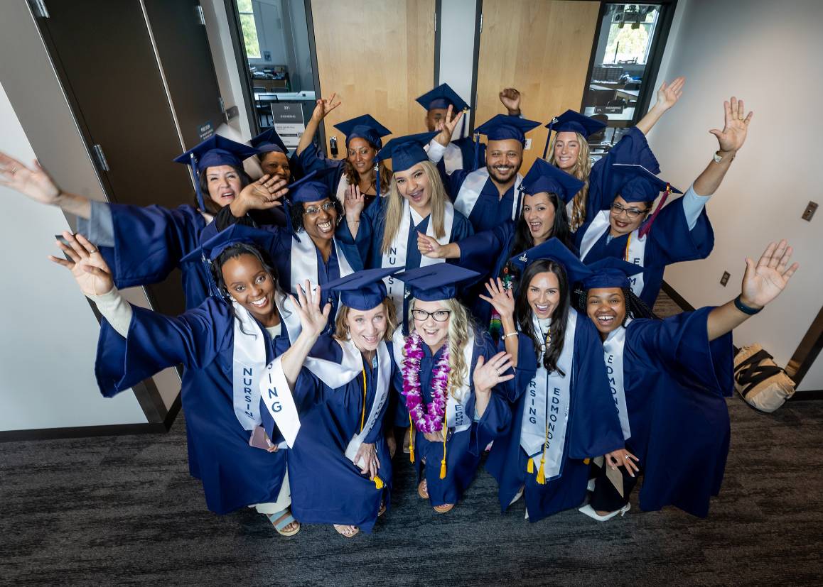 Students celebrate in Hazel Miller Hall before the start of the 2025 Commencement ceremony at Edmonds College. (photo by Scott Eklund / Red Box Pictures)