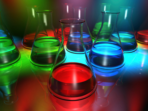 chemistry beakers with colorful liquids