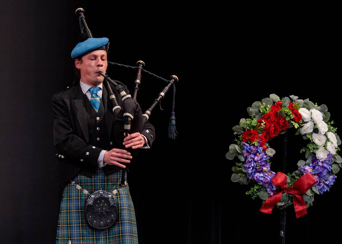 A member of Cascadia Pipe Band opens the 2025 Memorial Day ceremony on the campus of Edmonds College. (Photo by Arutyun Sargsyan)