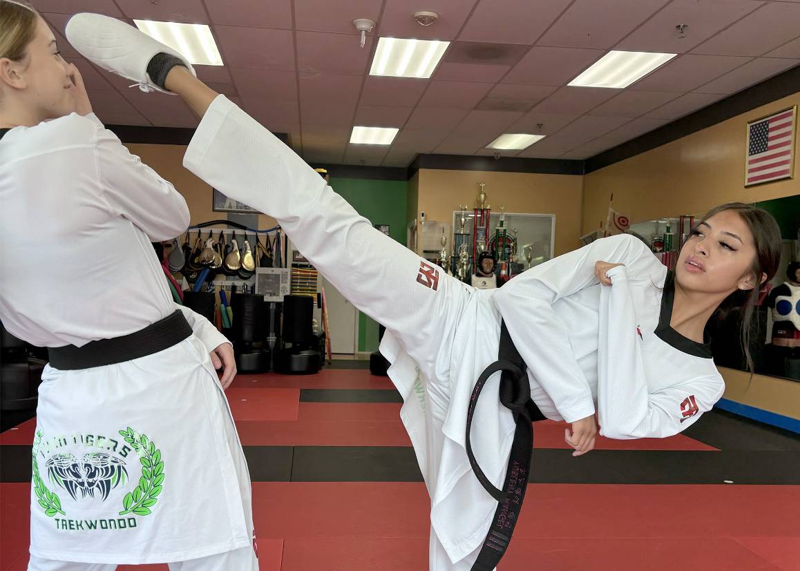 Yusleny Rangel (right) trains with Scarlet Wilson at Master Cho&rsquo;s in Lynnwood. (Photo by Brian Tom)
