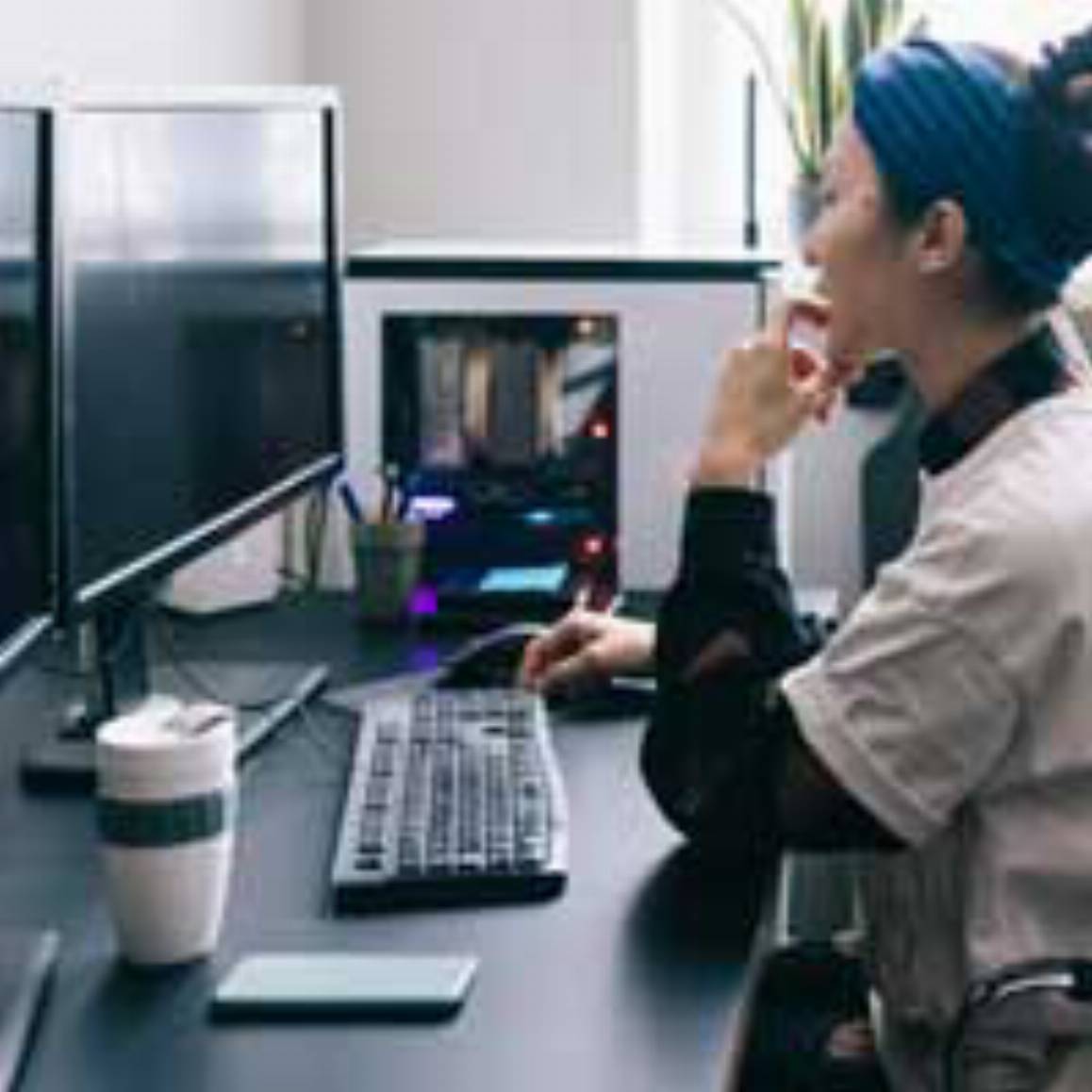 woman working on a desktop computer