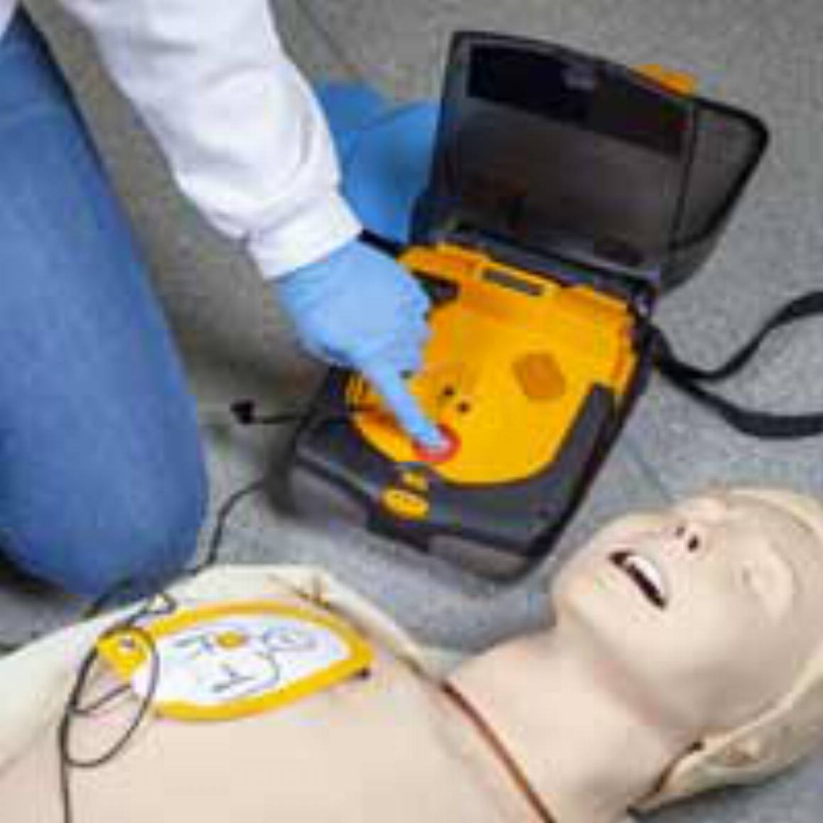 practicing CPR on a manikin