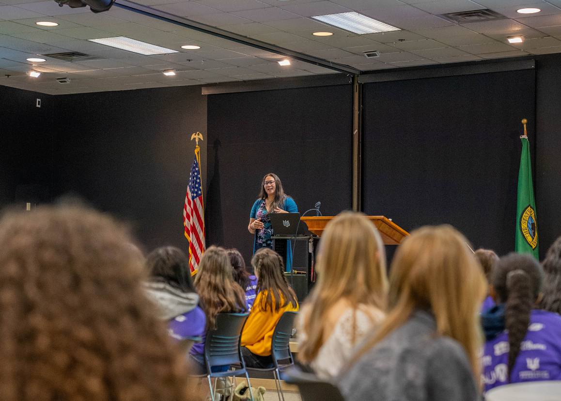 Keynote speaker Elise Castorina addresses the crowd of girls attending the Expanding Your Horizons event at Edmonds College. (Photo by Arutyun Sarsgyan)