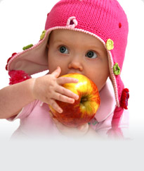 baby holding an apple