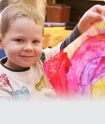 boy holding a painting 