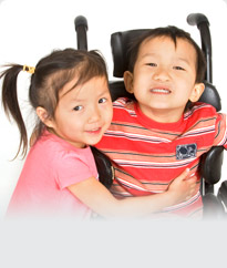 girl talking to boy in a wheelchair