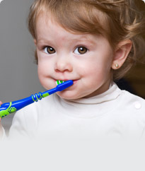 child holding a toothbrush