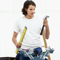 Construction worker holding tools