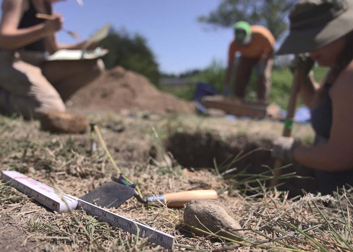 students working at the archaeolgy dig site