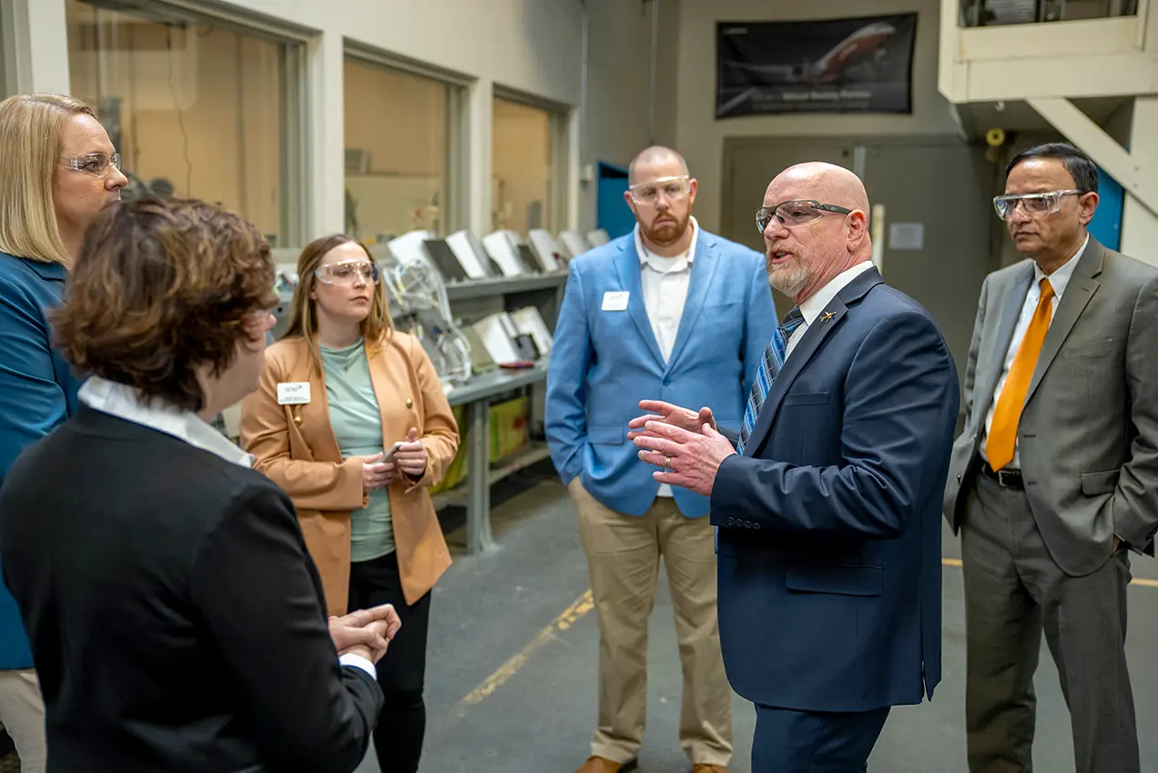 AMSC Executive Director Larry Cluphf meets with SME staff and Edmonds President Dr. Amit B. Singh prior to a press conference and tour at the Washington Aerospace Training and Research Center.