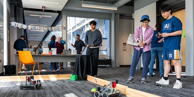 Students demonstrating use of robots at AI for Everyone Day at Edmonds College