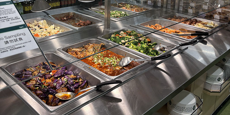Buffet style hot bar of fried rice, green beans, and chicken