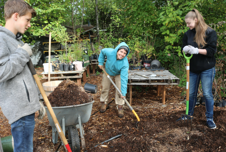 Service-learning students at a work party