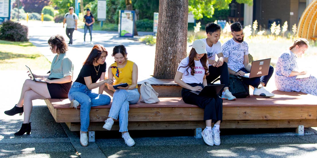 Students sitting in the courtyard near Lynnwood Hall