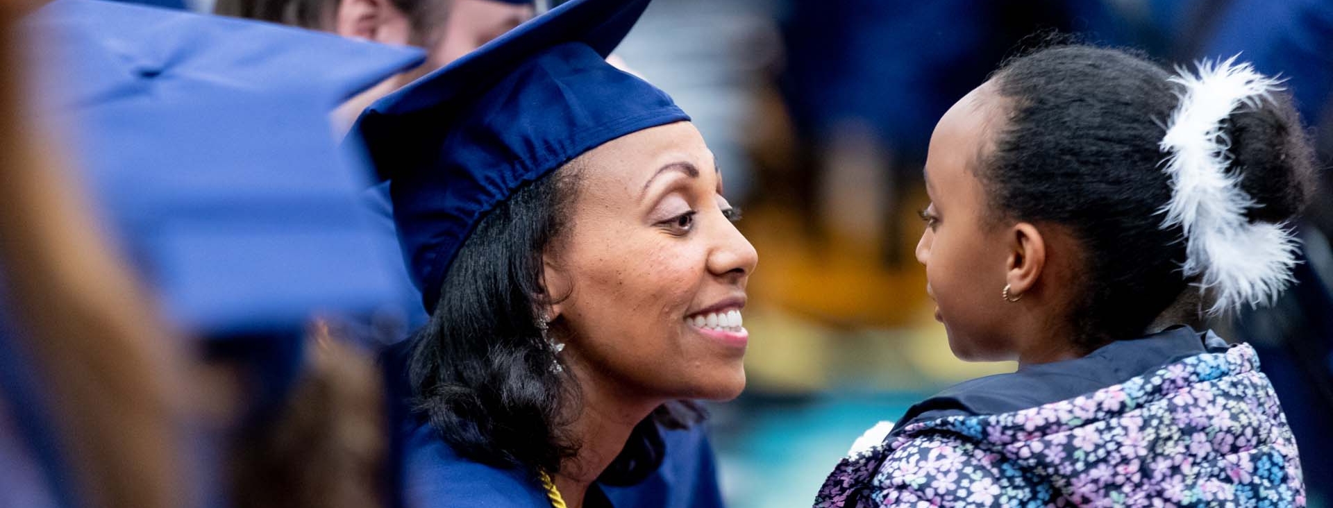 Student smiling at commencement