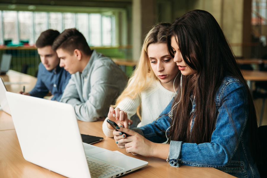 Students looking at computer