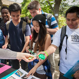Students visiting an activity table at springfest