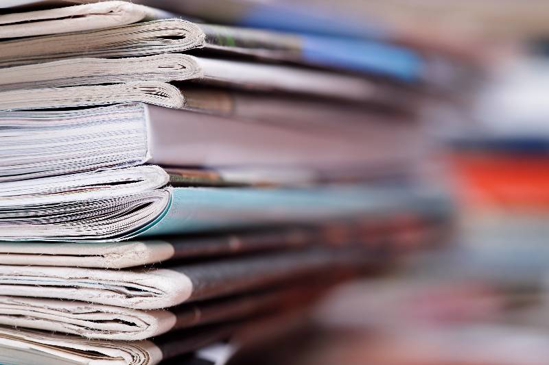 stack of newspapers and magazines