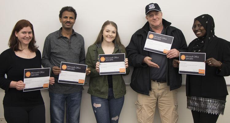 Students holding certificates