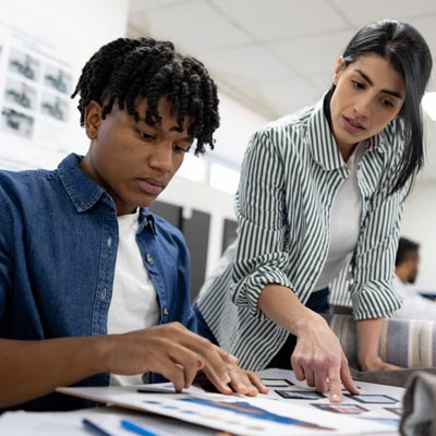 student talking with instructor