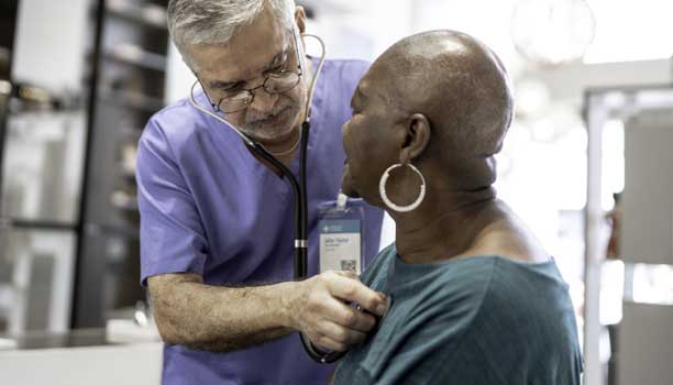 Nurse assistant working with patient