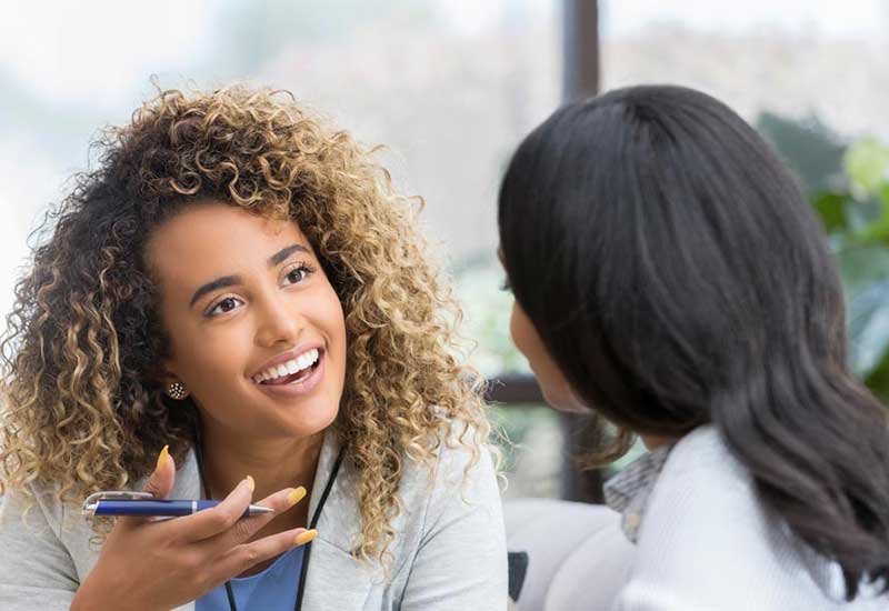 therapist talking to patient