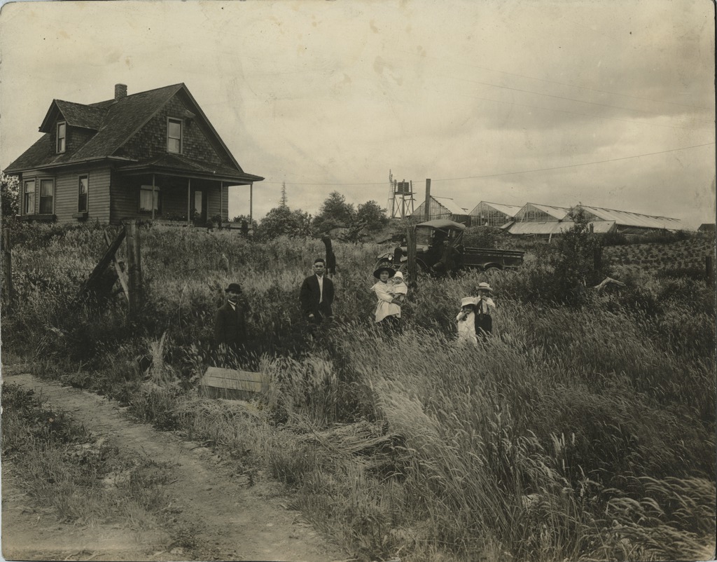 Family in front of home. Densho, Courtesy of the Kumasaka Family Collection