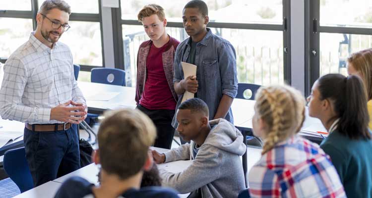 Teacher talking to students in the classroom