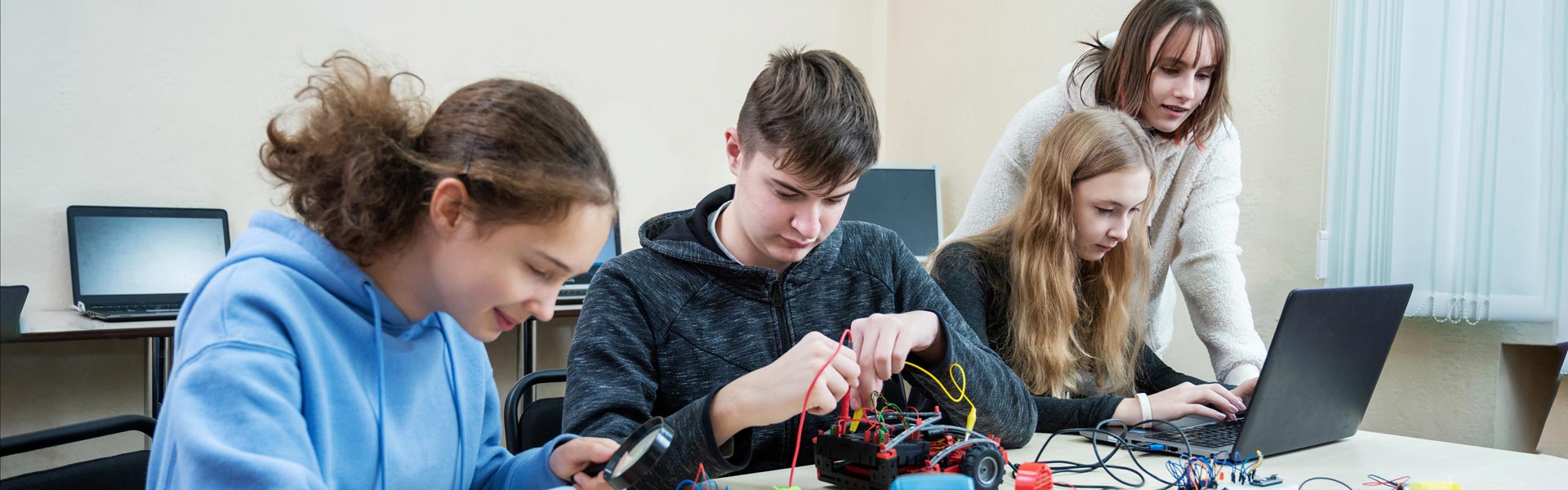 High Schoolers working on mechanical project