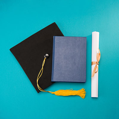 diploma and graduation cap