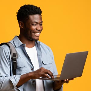 student holding a laptop