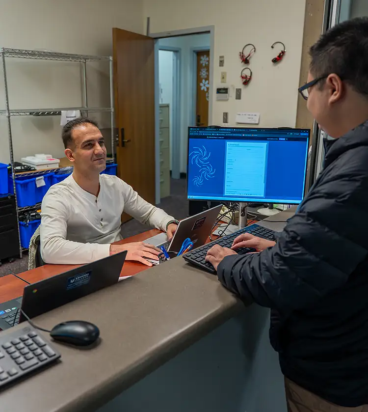 IT support tech helping student