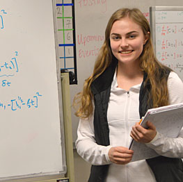 Woman in front of a white board