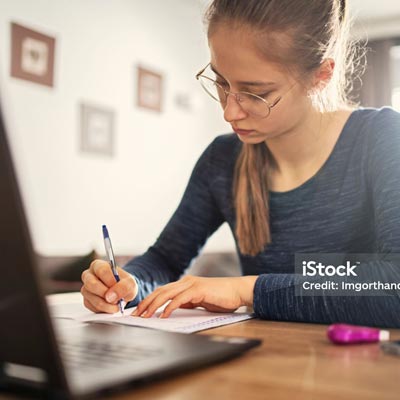 female student writing