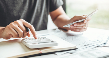 man using calculator